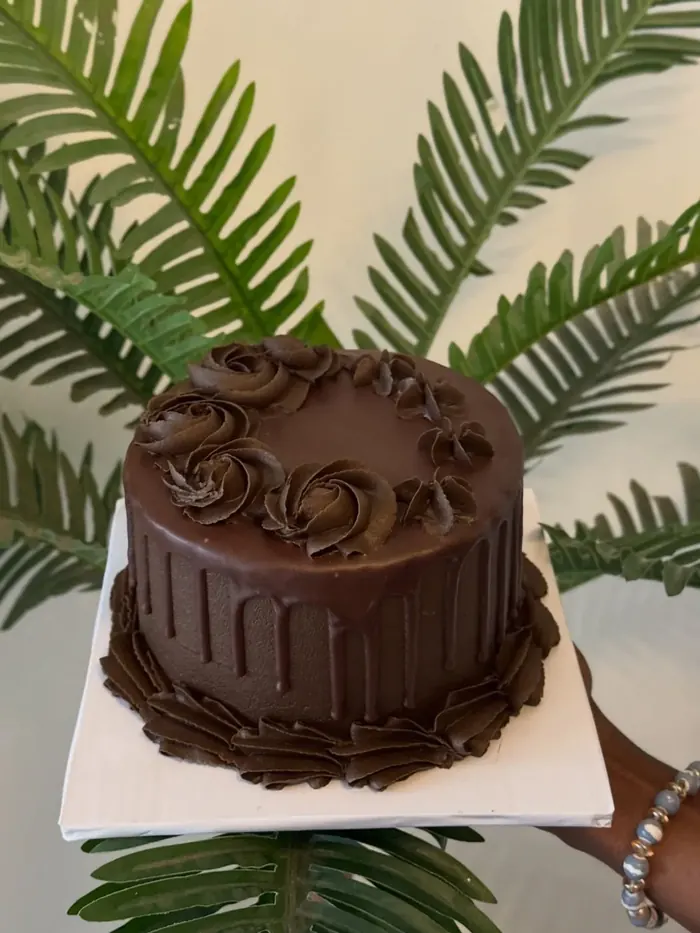 Chocolate ganache cake with piped chocolate rosettes