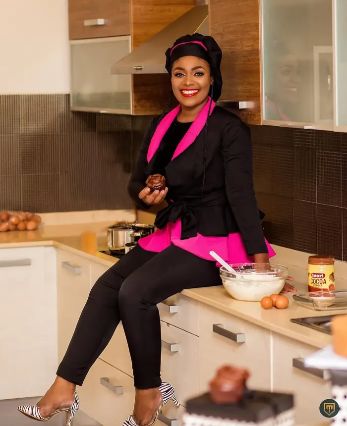 Tiffany sitting on the kitchen counter with a cupcake